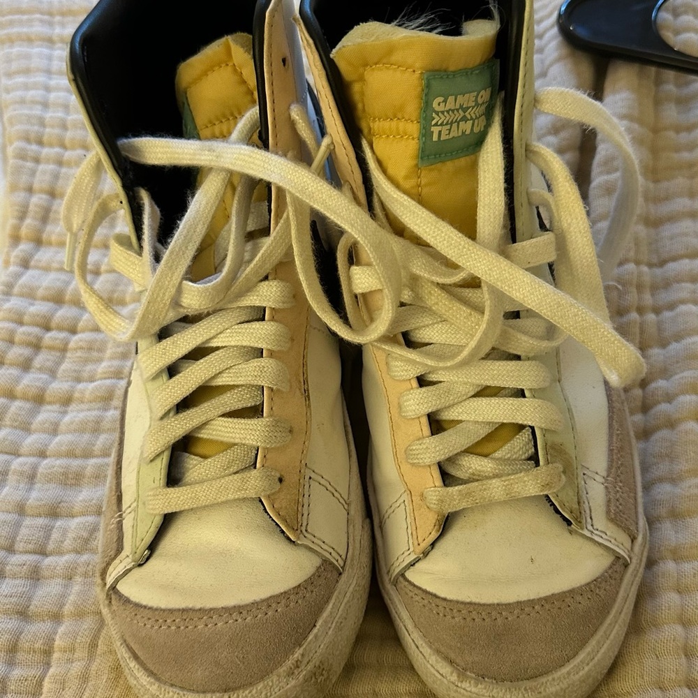 High-Top Nike Sneakers with Yellow and White Accents